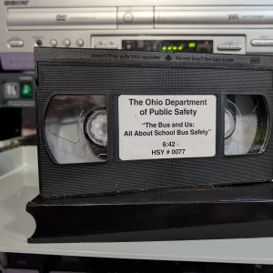 Ohio Dept of Public Safety tape HSY #0077. The Bus and Us, six-minute school bus safety educational film (VHS-2026-276)