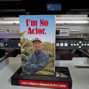 Red VHS shell reading Select Tobaccos Demand Perfect Aging. Winston Select cigarette promo from R.J. Reynolds (VHS-2025-033)