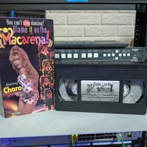 VHS-2026-1163: Blame it on the Macarena!, physical VHS tape in the 90s Craig archive.