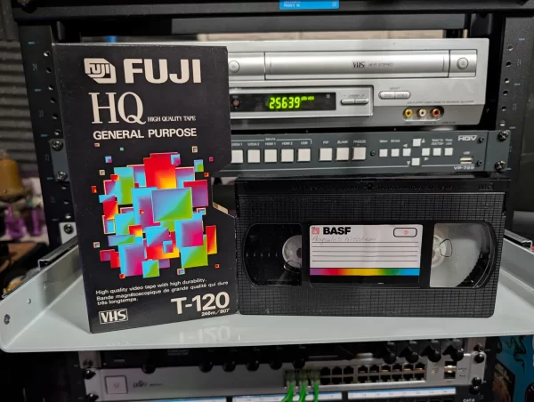 Fuji HQ T-120 sleeve beside a black BASF VHS labeled Pasquale’s Kitchen.