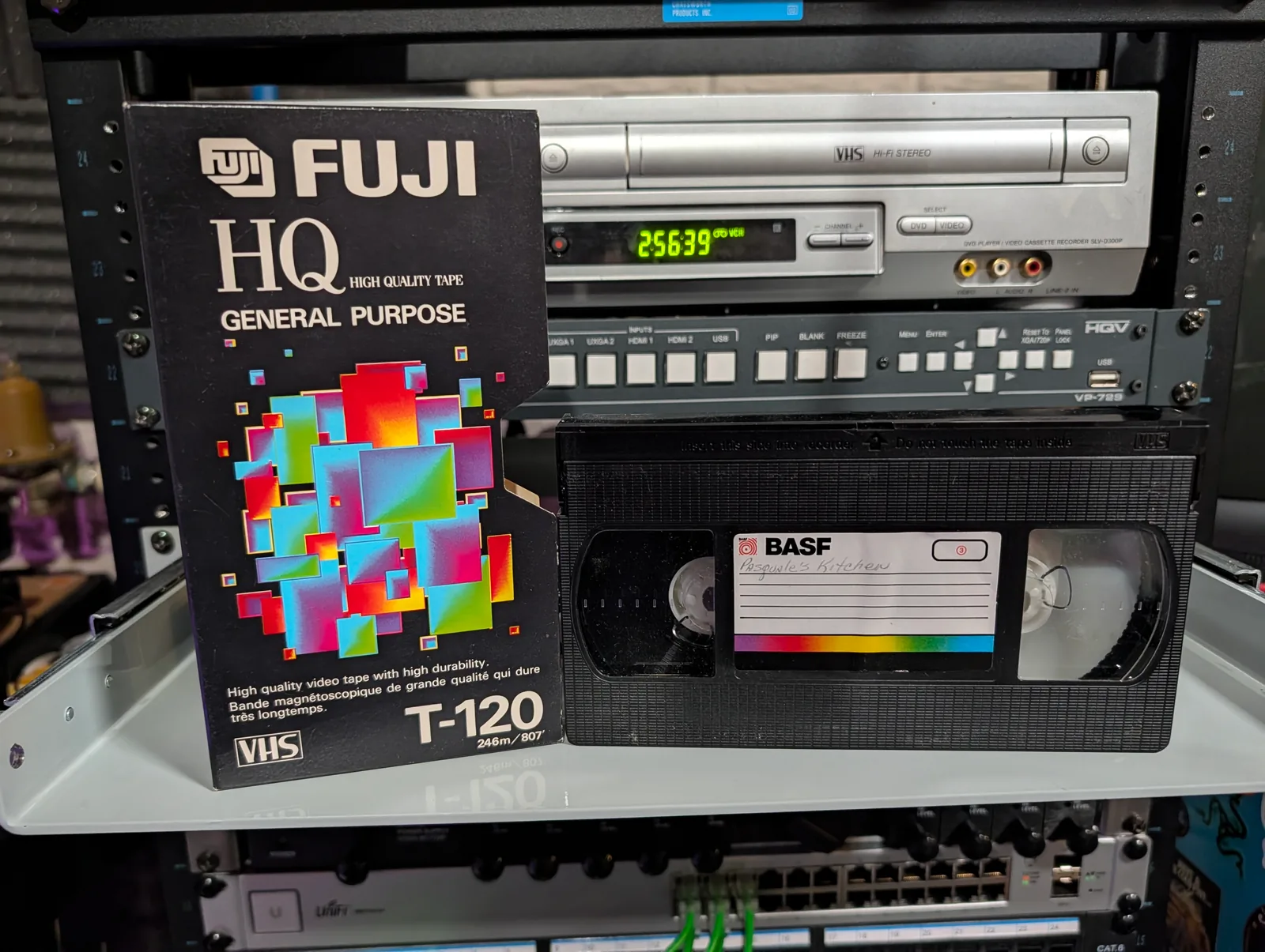 Fuji HQ T-120 sleeve beside a black BASF VHS labeled Pasquale’s Kitchen.