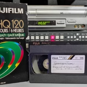 Fuji VHS tape and HQ120 sleeve; tape has a handwritten program label.