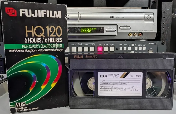 Fuji VHS tape and HQ120 sleeve; tape has a handwritten program label.
