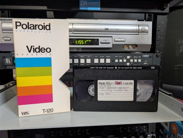 VHS-2026-330: Fuji HQ T-120 in mismatched Polaroid SuperColor sleeve label reads Something Wicked This Way Comes