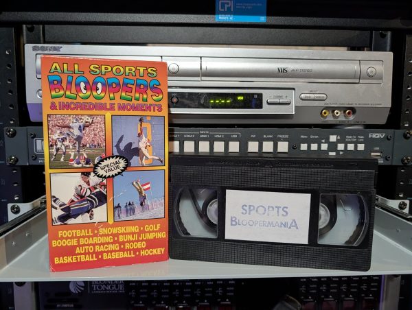 VHS-2026-005: Orange-rainbow VHS labeled Sports Bloopermania with Special Value sticker, 90s budget comp