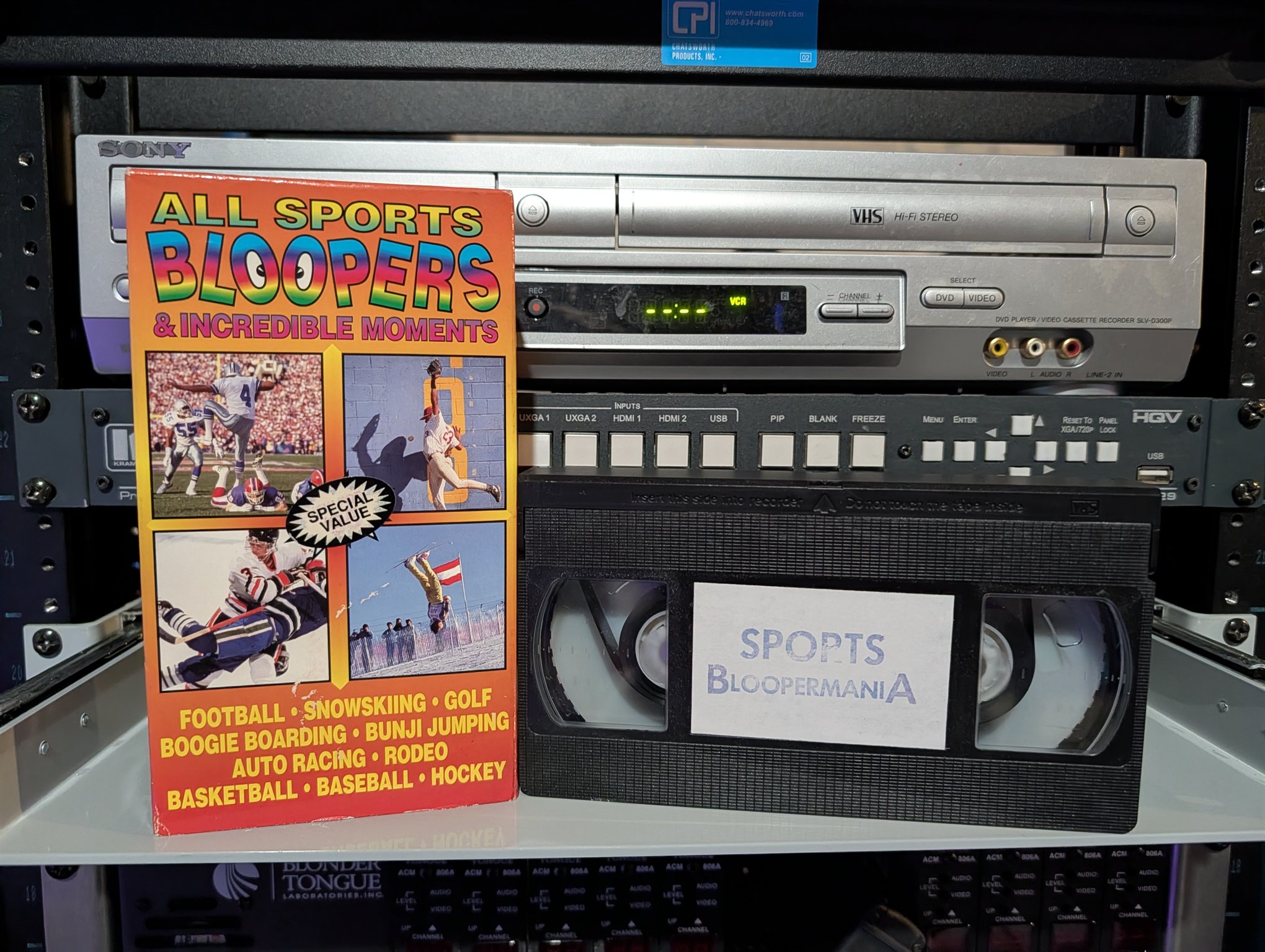 VHS-2026-005: Orange-rainbow VHS labeled Sports Bloopermania with Special Value sticker, 90s budget comp