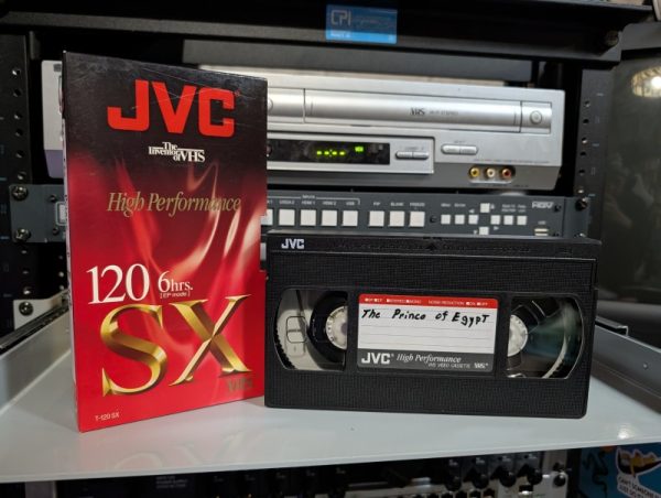 JVC T-120 SX red-and-gold sleeve, no label, late-90s Prince of Egypt TV recording with network commercials (VHS-2025-011)