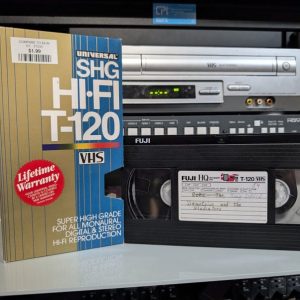 Hand-labeled VHS with scratched-out entries Kate and Westphal, partially illegible personal recording tape (VHS-2025-023)