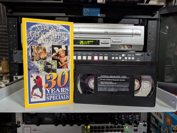 VHS-2026-453: Yellow National Geographic sleeve with camel caravan silhouette 30 years of TV specials, Jane Goodall era