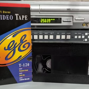 GE VHS tape beside its Premium Grade sleeve.