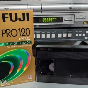 Full Fuji Pro 120 VHS tape beside its gold 6 Hours sleeve.