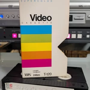 Polaroid Supercolor sleeve above a TDK tape with a handwritten Separate but Equal label.